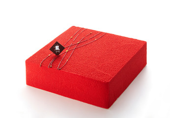 Delicate red velvet cake over white background