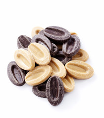 Granulated black and white chocolate on a white background
