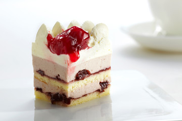 Beautifully designed cherry cake on a white background