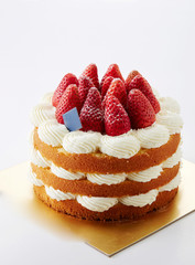 Delicious strawberry cake on white background