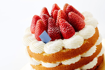 Delicious strawberry cake on white background