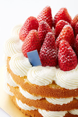 Delicious strawberry cake on white background