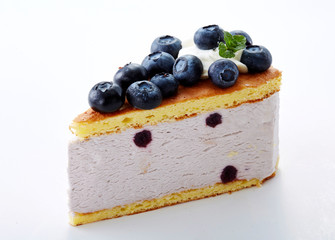 Delicious little cake cut pieces on a white background