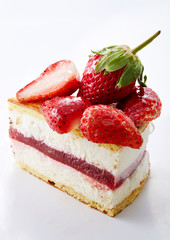 Delicious little cake cut pieces on a white background