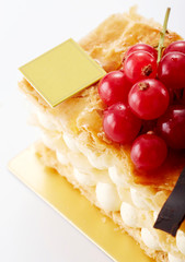 Delicious napoleon crumble cake on white background