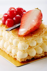 Delicious napoleon crumble cake on white background