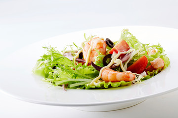 Delicious seafood salad on a white background