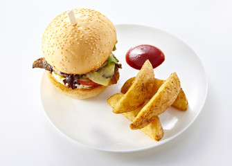 Tasty burger with french fries on a white background