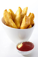 Delicious french fries on a white background