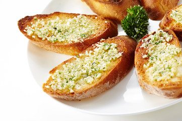 Delicious garlic bread on a white background