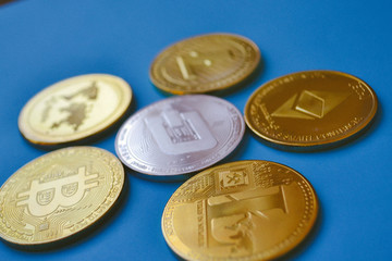 Crypto currency coins on blue background