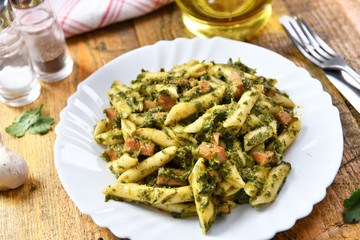 Penne pasta with spinach and meat