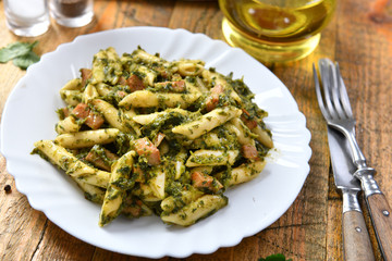 Penne pasta with spinach and meat