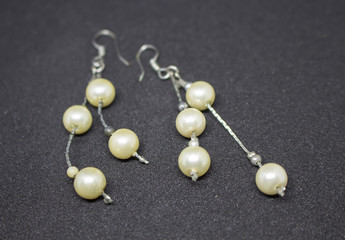 pearl necklace on black background