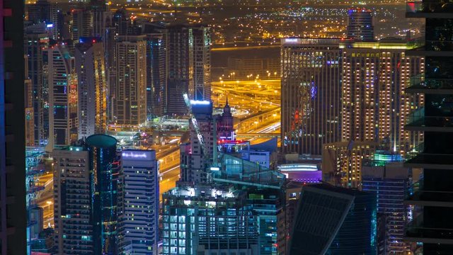Dubai night skyline panorama time-lapse UAE. zoom out