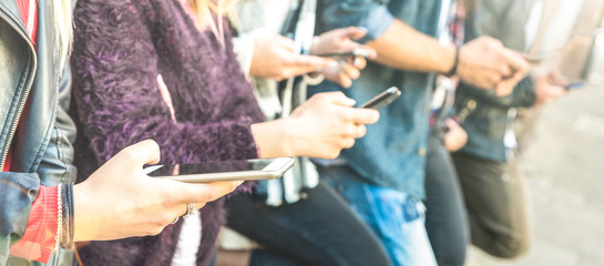 Multicultural friends group using smartphone at university college backyard break - People hands...