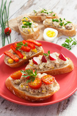 Crusty sandwiches or baguette with mackerel or tuna fish paste, concept of healthy nutrition