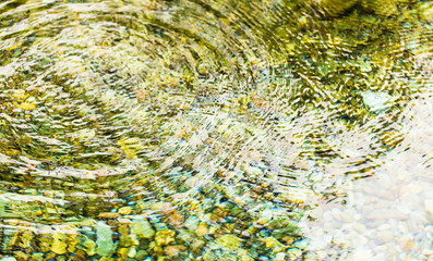 Circles on the surface of the reservoir as a background