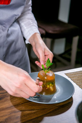 Chef decorates the aspic from sterlet, pikeperch and shrimp. Master class in the kitchen. The process of cooking. Step by step. Tutorial. Close-up