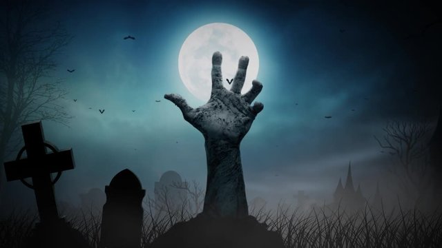 Haunted Graveyard Zombie Hand Out of Ground 4K Loop features a hand protruding up from the ground with subtle movement with a full moon and gravestones 