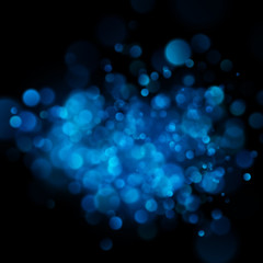 Abstract defocused circular blue bokeh on dark background. EPS 10