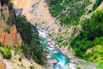 Montenegro mountains landscape . The blue river flows in a deep canyon among the high mountains covered with green forest in Montenegro.