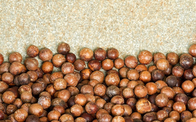 Close up a pile of macadamia in shell background