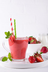 Delicious strawberry smoothie. Morning drinks with fresh berries, yogurt or milk