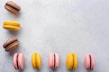 Colorful macaroons on white stone background Top view, Copy Space 