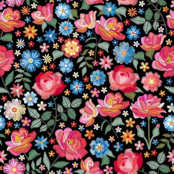 Embroidery seamless pattern with beautiful flowers. Bright floral print with spanish motives. Fashion design with satin stitch. Vector embroidered illustration.