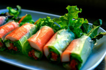 Roll salad in a white dish