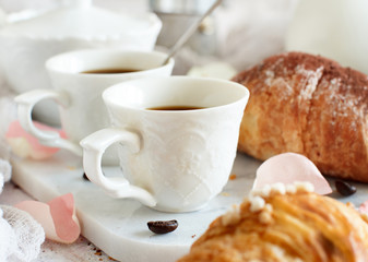 Breakfast with coffee and croissant