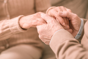 Fototapeta premium Close up of male hands that holding his wife