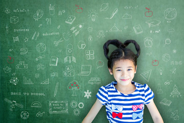 Smart educated school kid student with doodle on chalkboard  for children's world literacy day and scholarship concept