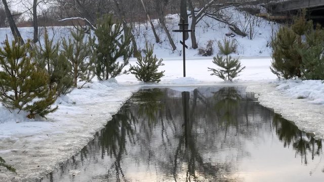 diving into the hole in baptism. Orthodox holiday baptism. people dive in cold water in winter