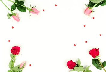 Flowers background. Border frame of beautiful pink and red roses on  white background. Holiday background. Top view.Copy space