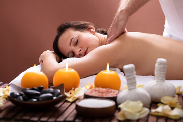 Obraz na płótnie Canvas Therapist Massaging Woman's Back
