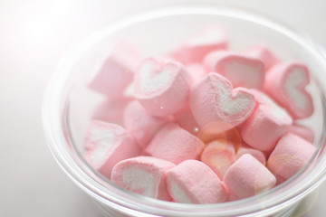 Fototapeta na wymiar Valentines day concept. Heart shape of marshmallow in pink and white color in bowl.