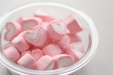 Valentines day concept. Heart shape of marshmallow in pink and white color in bowl.