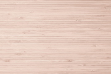 Fototapeta premium Bamboo natural wood texture pattern background in light red cream beige brown color