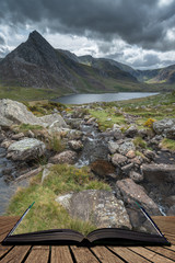 Stunning landscape image of countryside around Llyn Ogwen in Snowdonia during ear;y Autumn coming out of pages of open story book - obrazy, fototapety, plakaty