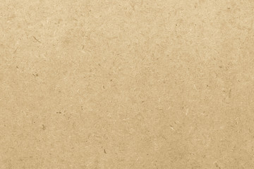 Particle pressed wood panel osb oriented strand board texture pattern background in light beige cream yellow gold color