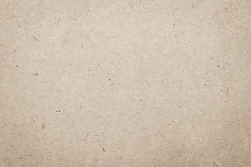 Particle pressed wood panel OSB - oriented strand board texture background in light brown beige cream color