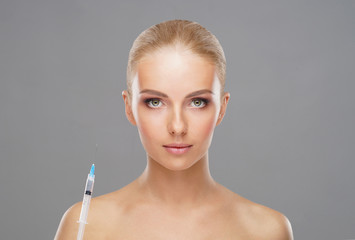 Beauty injection in a face of a young woman. Plastic surgery concept.