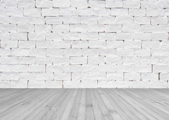 Grunge old aged brick wall painted in white color with wooden floor textured background in light grey