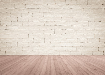 Brick wall painted in cream beige color with wooden floor textured background in natural red brown