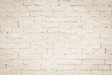 Old aged rough brick wall texture background painted in light beige color in grunge style