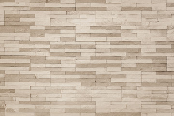 Brick stone tile wall pattern background in sepia brown