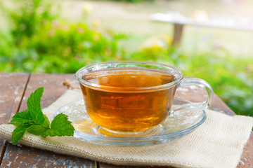 A Cup of tea on a wooden table.