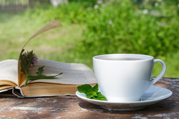 A Cup of tea on a wooden table.